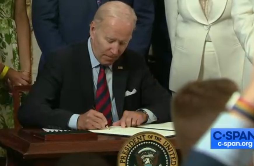 President Joe Biden signs an executive order that expands LGBTQ rights