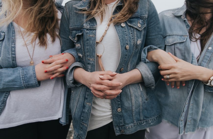 woman in blue denim jacket and white shirt