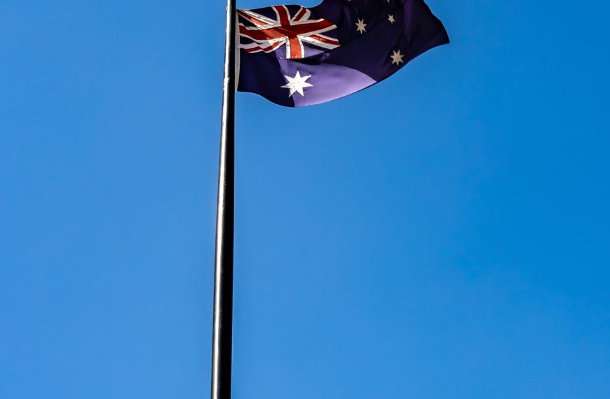 blue white and red flag under blue sky during daytime